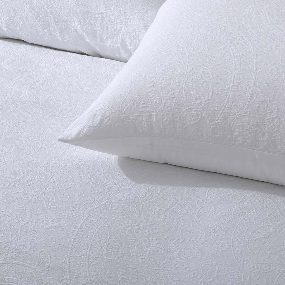 Estelle Jacquard Super King Bedding in an elegant white, enhancing the grandeur of the room.